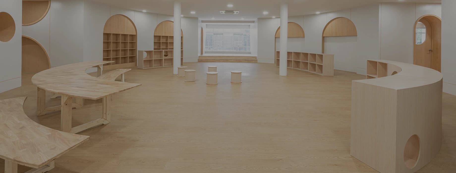 Modern public space with light wood flooring